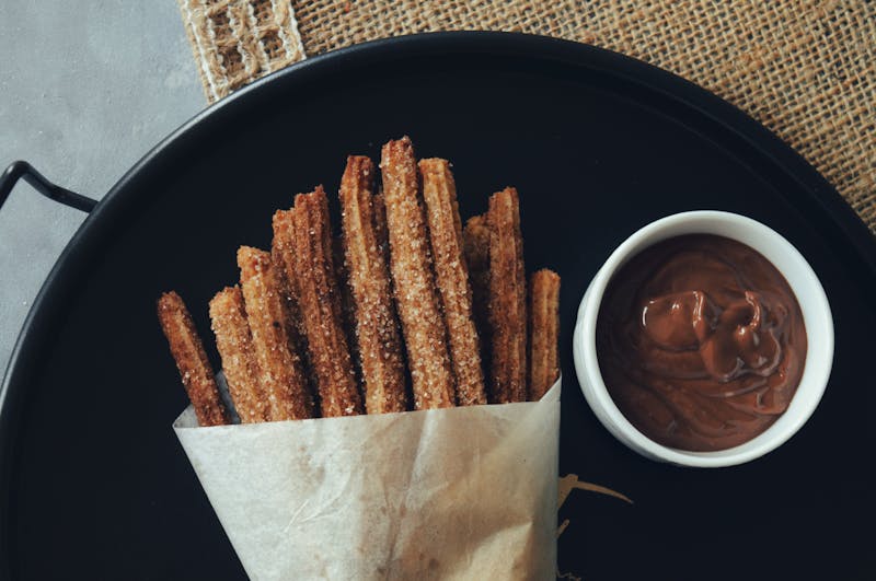 Warm churros with chocolate dipping sauce at Chuys